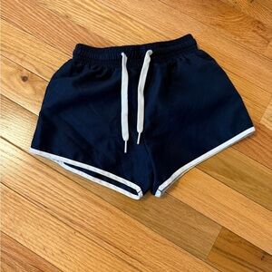 Navy Blue kids’ swim trunks with White Trim